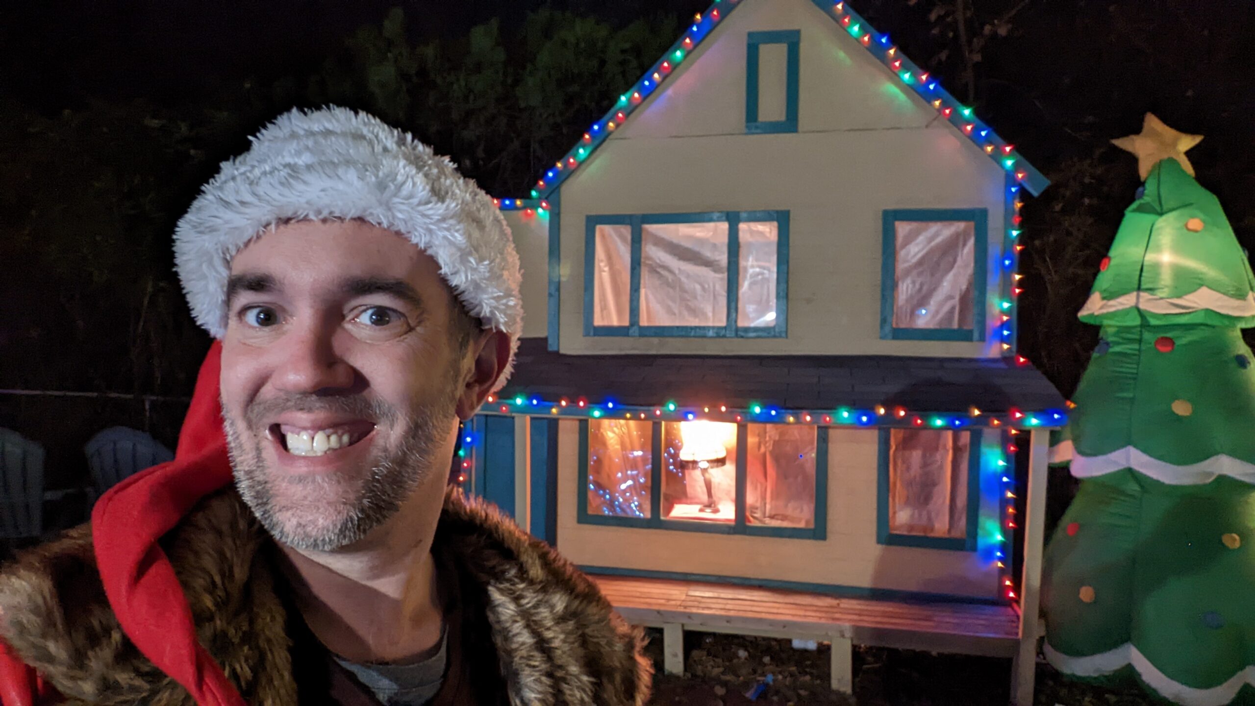 A Christmas Story house replica with the leg lamp in the window